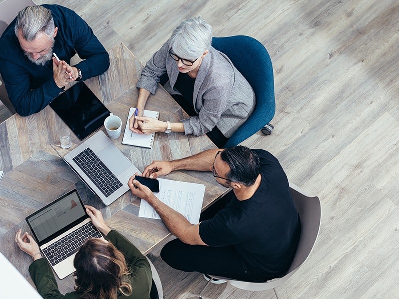 Making Technology Work For You Team Discussing New Strategies | ITque